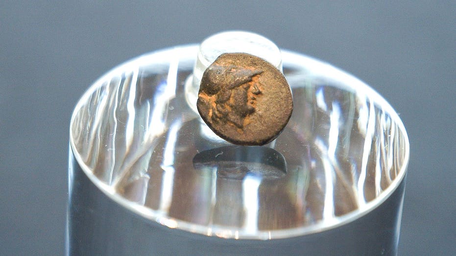 Teen stumbles on mysterious coin from legendary city, puzzling archaeologists over its journey Adelaide Schools